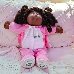 An original 1982 Cabbage Patch Doll. She is a vintage African American.